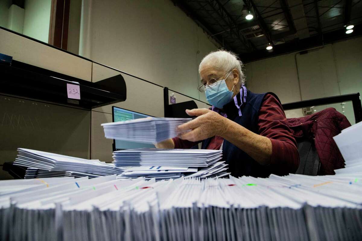 Harris County clerk Judith Rubio, sorts early voting by mail ballots at the Harris County elections headquarters on Friday, Sept. 25, 2020, in Houston.