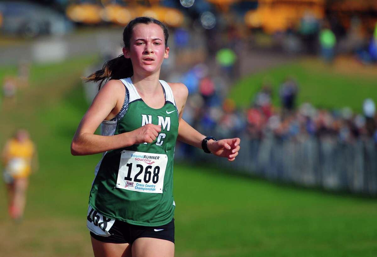 New Milford's Claire Daniels crosses the finish line for second place during Class L cross country championship action in Manchester, Conn., on Saturday Oct. 26, 2019.