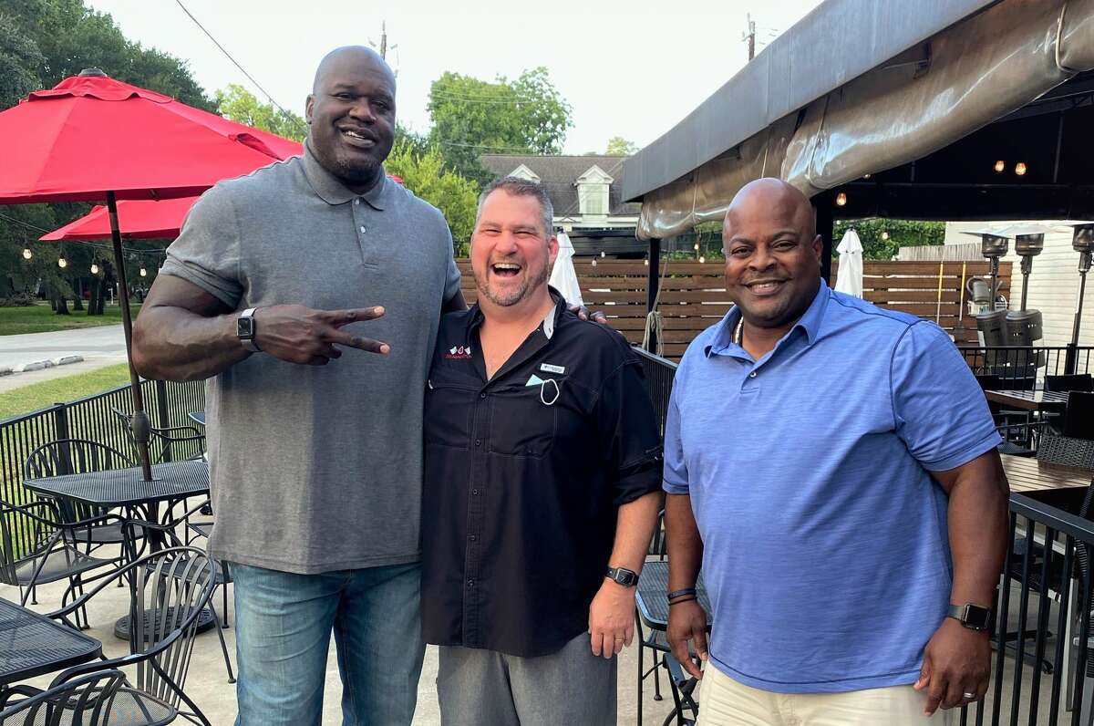 Shaquille O'Neal, Gr8 Plate Hospitality owner Paul Miller, and Houston Police Officer Kenneth Miles at The Union Kitchen Memorial on Oct. 19, 2020.