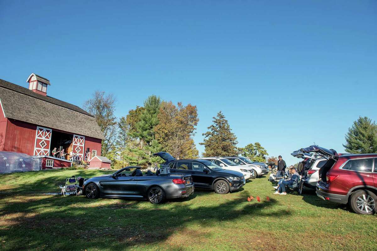 Concert-goers enjoy the music of Mr. Know It All at Ambler Farm’s “Red Barn Live” drive-in concert earlier this month in Wilton, Connecticut. A temporary event permit is needed to have an event in the Town of Wilton, according to the first selectwoman’s office.