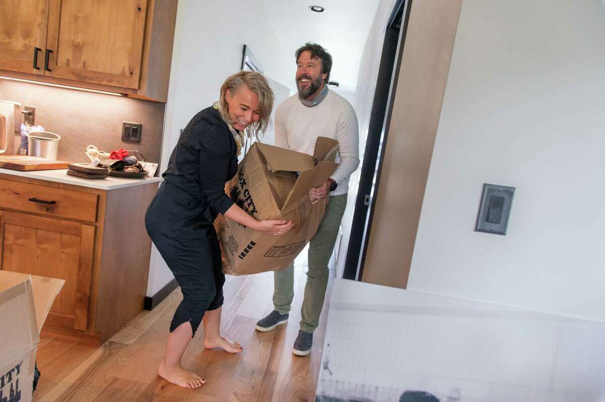 Robert and Valentina Carder move into their new home in Bozeman, Mont., in August. They fled Los Angeles.