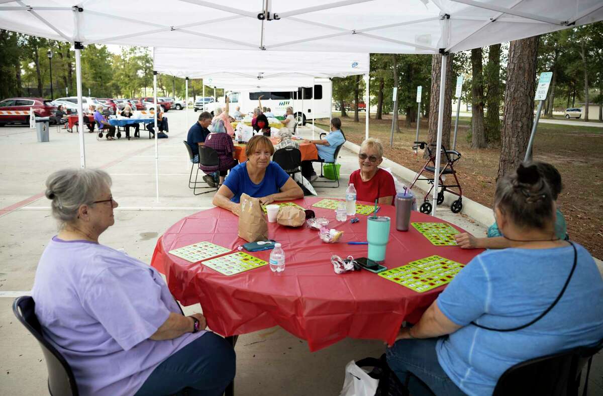 Tents and tables are social distanced during an event hosted by the Conroe Senior Center called the Parking Lot Party at Candy Cane Park, Tuesday, Oct. 20, 2020, in Conroe. Participants were able to play bingo, receive prizes and enjoy a complimentary lunch from Red Brick Tavern.