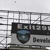 A sign for the Canajoharie Exit 29 project is displayed above of the former Beech-Nut factory on Tuesday, Oct. 20, 2020, in Canajoharie, N.Y. (Will Waldron/Times Union)