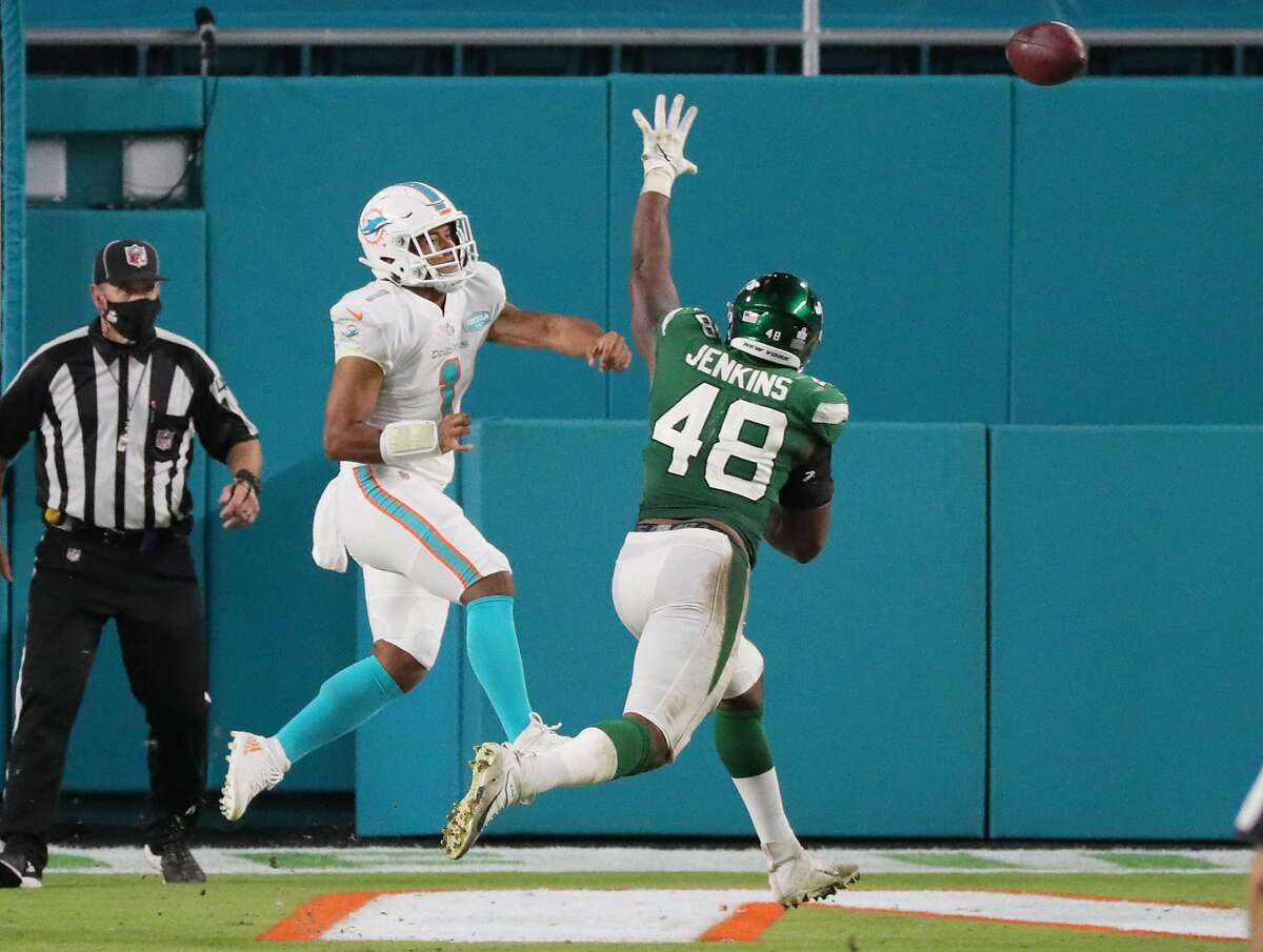 Miami Dolphins quarterback Tua Tagovailoa (1) throws his first pass in the NFL in the fourth quarter against the New York Jets on Sunday, Oct. 18, 2020 at Hard Rock Stadium in Miami Gardens, Florida. (Charles Trainor Jr./Miami Herald/TNS)