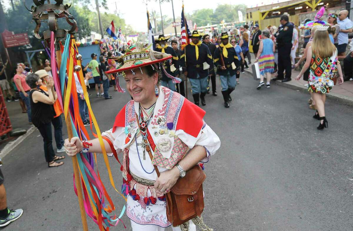 Huichol Shaman Christopher Wallace leads a procession to kick off the opening of Night in OId San Antonio during 2018’s Fiesta Week. This year, the Conservation Society is holding a more modest event, the Fall Heritage Festival. Nevertheless, the small-business owners at La Villita are concerned about the public heath risks.