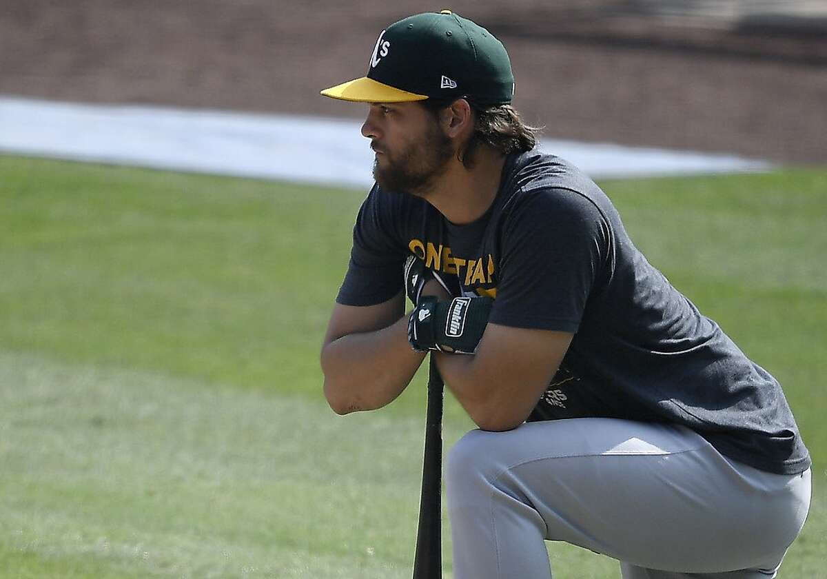 LOS ANGELES, CALIFORNIA - OCTOBER 08: Chad Pinder #18 of the Oakland Athletics looks on during batting practice against the Houston Astros in Game Four of the American League Division Series at Dodger Stadium on October 08, 2020 in Los Angeles, California. (Photo by Kevork Djansezian/Getty Images)