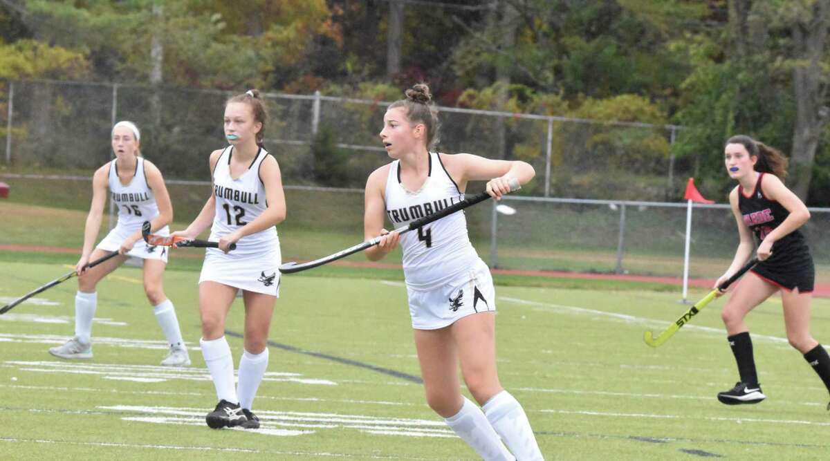 Sophomore Maura Carbone (4) scored the game-winning goal in the Eagles' victory over Fairfield Warde. Trumbull's Alexandra Baratta (12) and Ella Consia (16) hone in on the action.