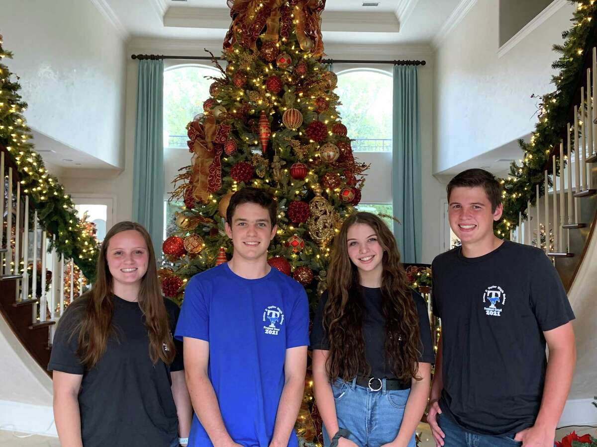 Taylor High School’s Holiday Home Tour is slated for Thursday, Dec. 3, through Saturday, Dec. 5. The tour features homes decorated for the holidays and raises funds for the school’s Project Graduation, which gives seniors a safe way to celebrate their graduation. Here from left, Maya Geraci, Matthew Stokes, Megan McNichol and Ethan Mefford, all Taylor seniors and children of Project Graduation board members, pose at a tour home on Wednesday, Oct. 21.