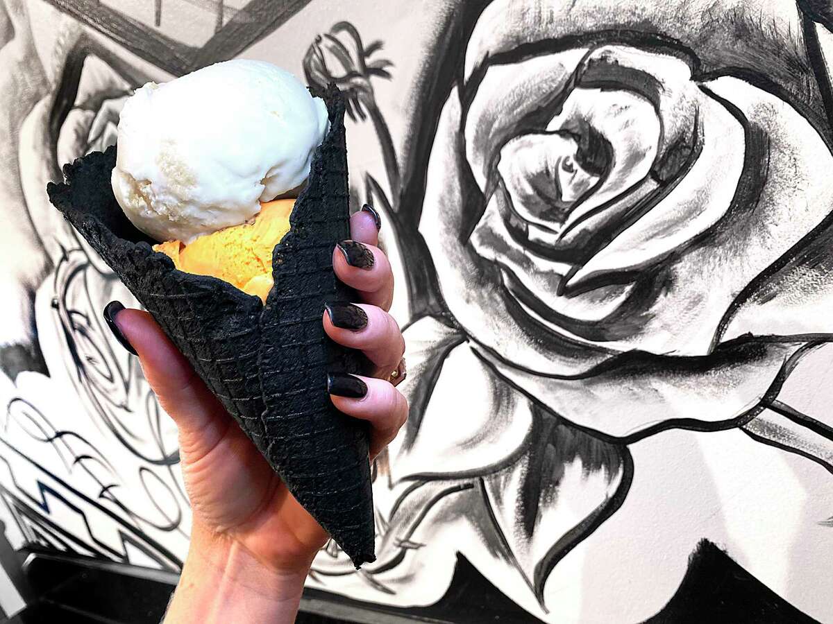 Ice cream options at Black + White Modern Creamery include a black vanilla waffle cone with Thai iced tea ice cream and cornbread and honey ice cream.