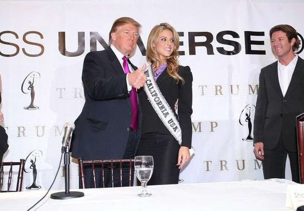 Keith Lewis, far right, stands with then Miss Universe President Donald Trump and Miss California Carrie Prejean at a press conference at Trump Tower on May 12, 2009 in New York City. (Photo by Michael Loccisano/Getty Images)