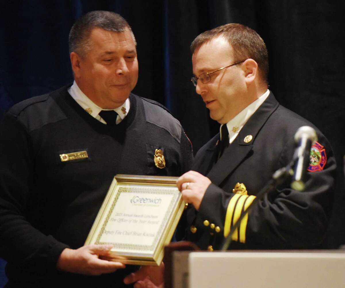 New Assistant Fire Chief Brian Koczak, at right, was presented with a Public Service Award at the Greenwich Chamber of Commerce Awards Luncheon at the Hyatt Regency in 2015 by now-former Fire Chief Peter Siecienski. Koczak will be sworn in for his promotion on Monday.