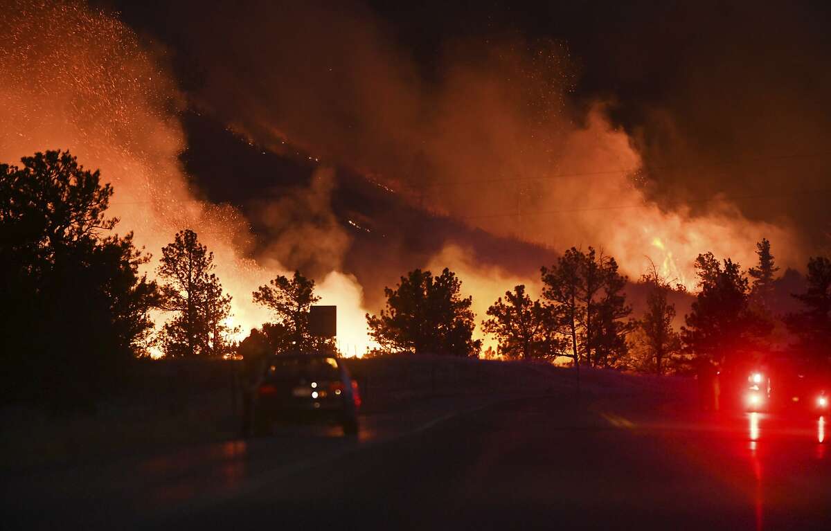 On Sunday, Oct. 11, 2020, the Wild Horse Fire kicks up along Hwy. 115, just south of Colorado Springs, Colo. Earlier in the afternoon, the fire started on the west side of the highway and eventually jumped to the Ft. Carson side. There were red flag warnings on Sunday with 40-50 mph at the time of the fire. There were about 100 firefighters from15 different agencies dispatched to the fire. (Jerilee Bennett/The Gazette via AP)