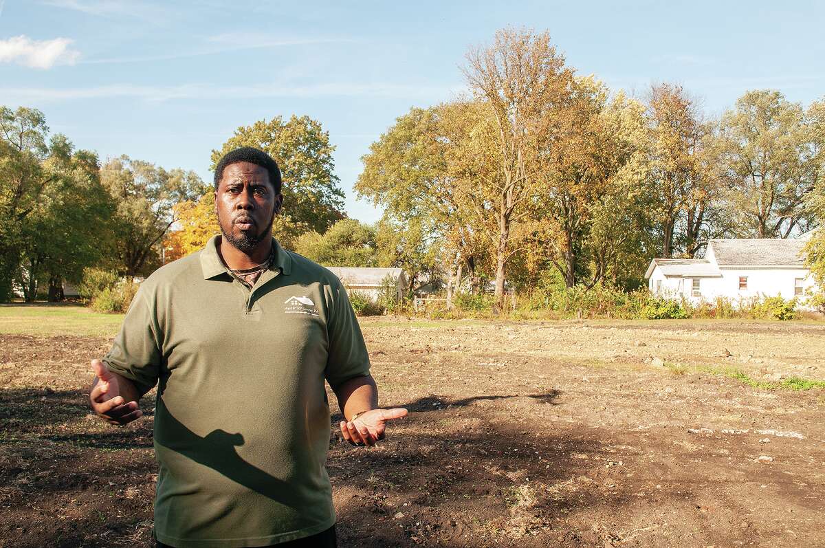 Samuel Holmes Jr. stands at North Clay Avenue and East Walcott Street as he describes the Humble Beginnings Outreach Center that is slated to be completed by summer. Phase 1 of the project will be a 4,000-square-foot building providing office space for rent and a recreational area for kids.