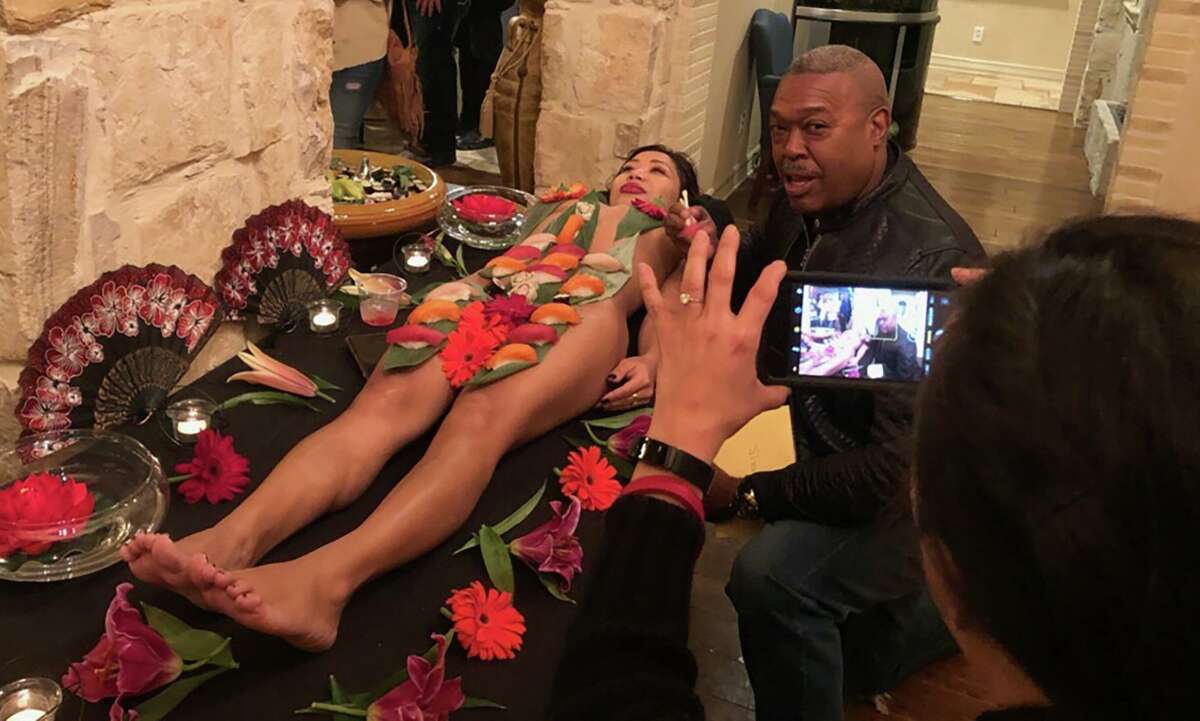 San Antonio Fire Chief Charles Hood ate sushi next to a mostly nude woman at a firefighter’s birthday party earlier this year, taking part in a Japanese practice that has been criticized for objectifying and degrading women.