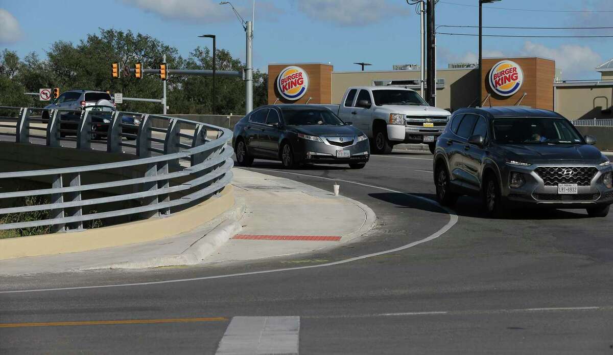 Motorists make their way around the intersection of FM 1560 and and Riggs Road in Helotes on Wednesday, Oct. 21, 2020. Concerned Helotes residents, COPS/METRO and elected officials worked together and persuaded the Texas Department of Transportation to remove a cement wall that created a dangerous intersection and have landscaped the area making it safer and better-looking.