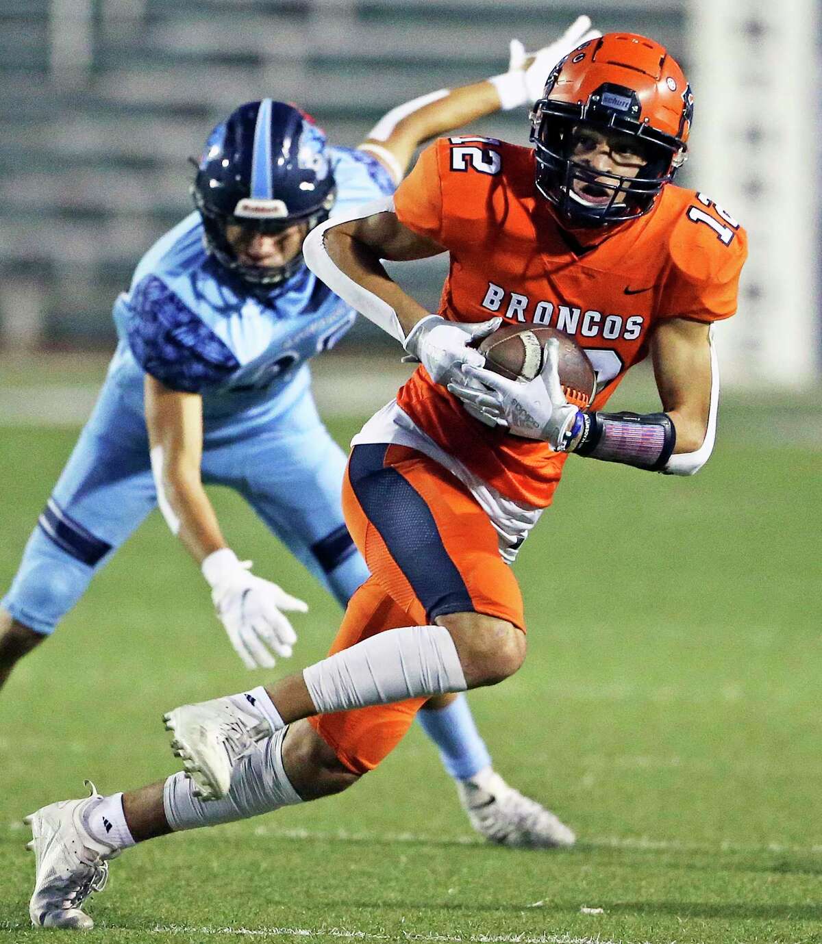 Bronco receiver Josh Suarez slips under a defender and makes it to the sideline after a catch as Brandeis hosts Johnson at Farris Stadium on Oct.22, 2020.