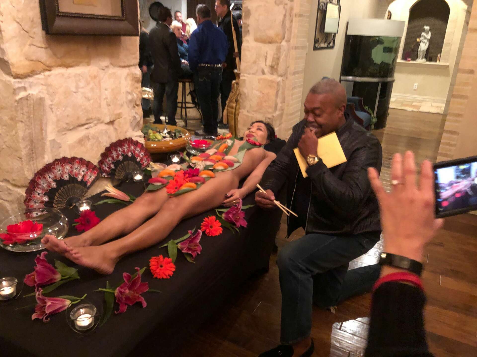 UPDATE: San Antonio Fire Chief Charles Hood defends posing for photo eating  sushi displayed on nude woman