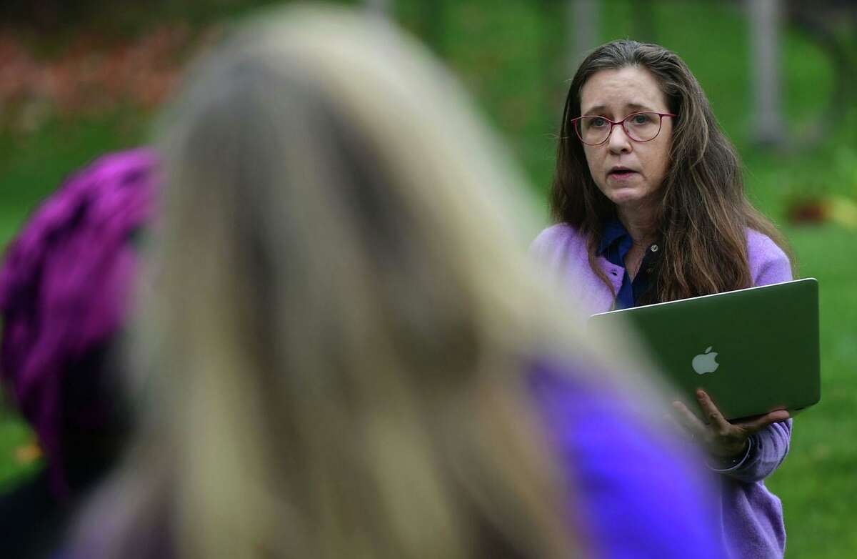 A family friend of Jennifer Dulos, Carrie Luft, gives her address as Connecticut Protective Moms hosts an awareness event for Domestic Violence Awareness Month at the Bush Holley House Historical Society Thursday, October 22, 2020, in Greenwich, Conn. The event focused on keeping the bill named after Jennifer Dulos, Jennifer's Law, alive.