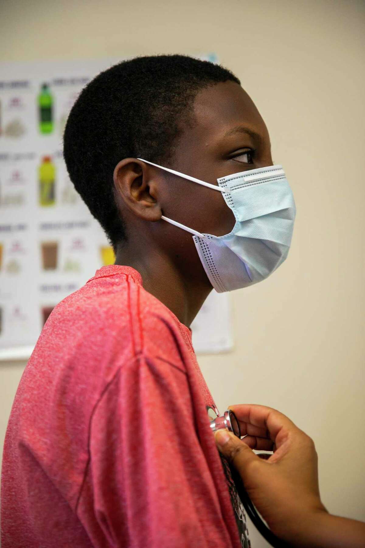 Thirteen-year-old Jhony Santos has his heart checked at the Elrod Health Center, a school-based clinic inside of Elrod Elementary School on Monday, Oct. 19, 2020.