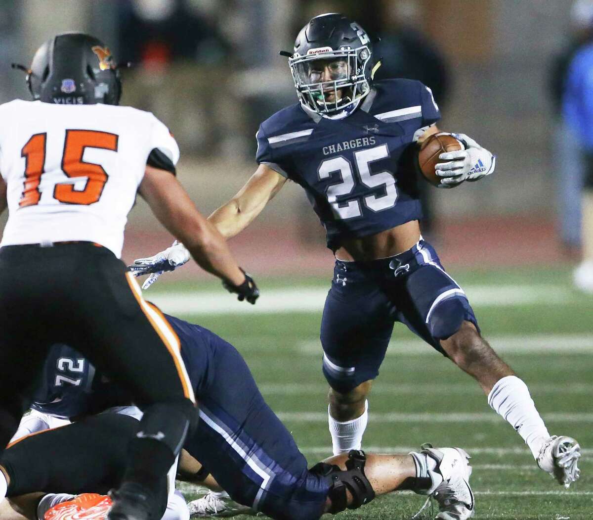 Chargers srunning back Alex Rodriguez steps out to make a move away from Seth Bullard as Boerne Champion hosts Medina Valley at Greyhound Stadium on Oct. 23, 2020.