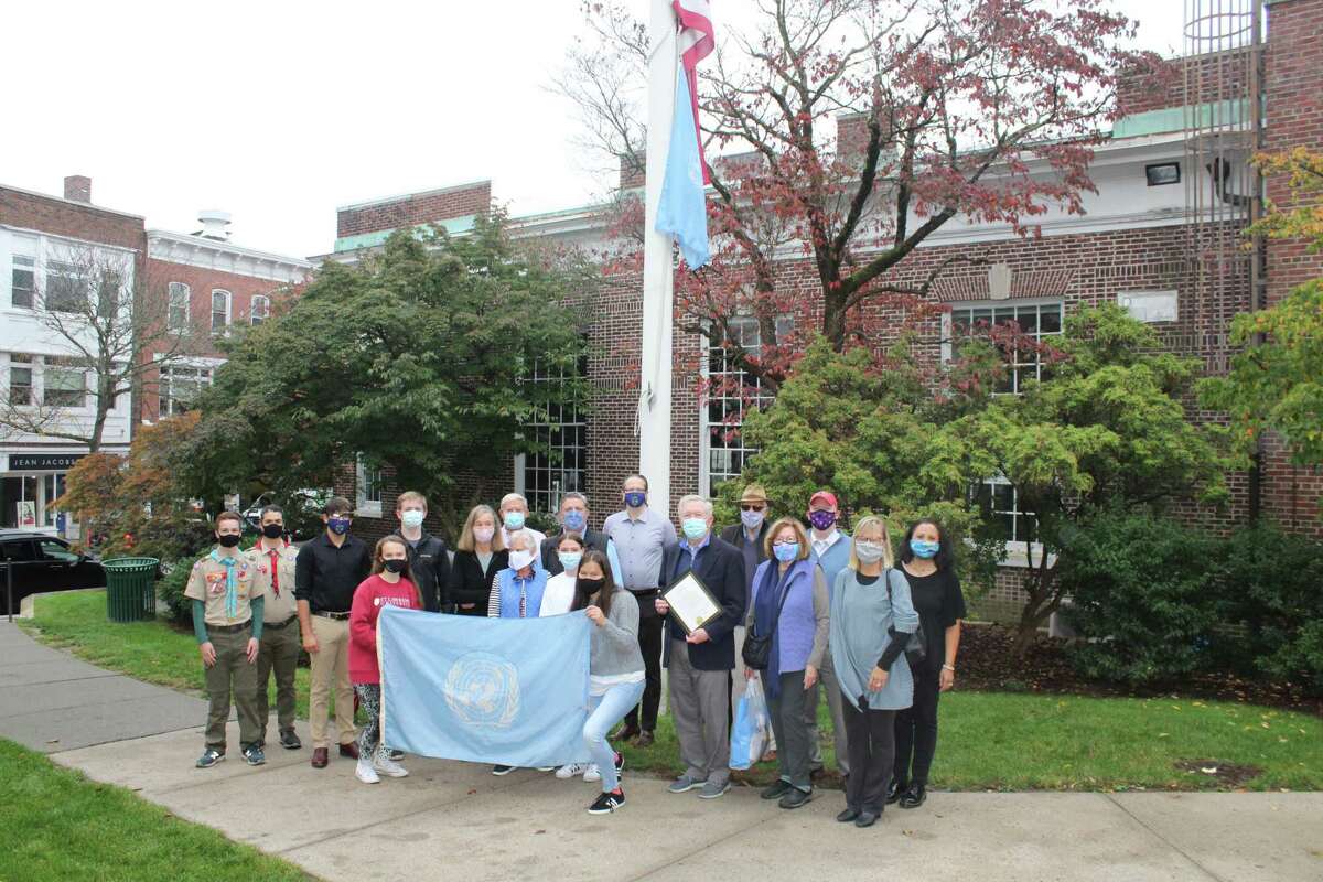First Selectman Kevin Moynihan, Boy Scouts, members of the New Canaan UN Committee and members of the Model UN at New Canaan High School gather in front of Town Hall Saturday morning, Oct. 24, to raise the UN flag. Moynihan proclaimed Saturday — the 75th anniversary of the United Nations — as UN Day in New Canaan, an annual tradition.