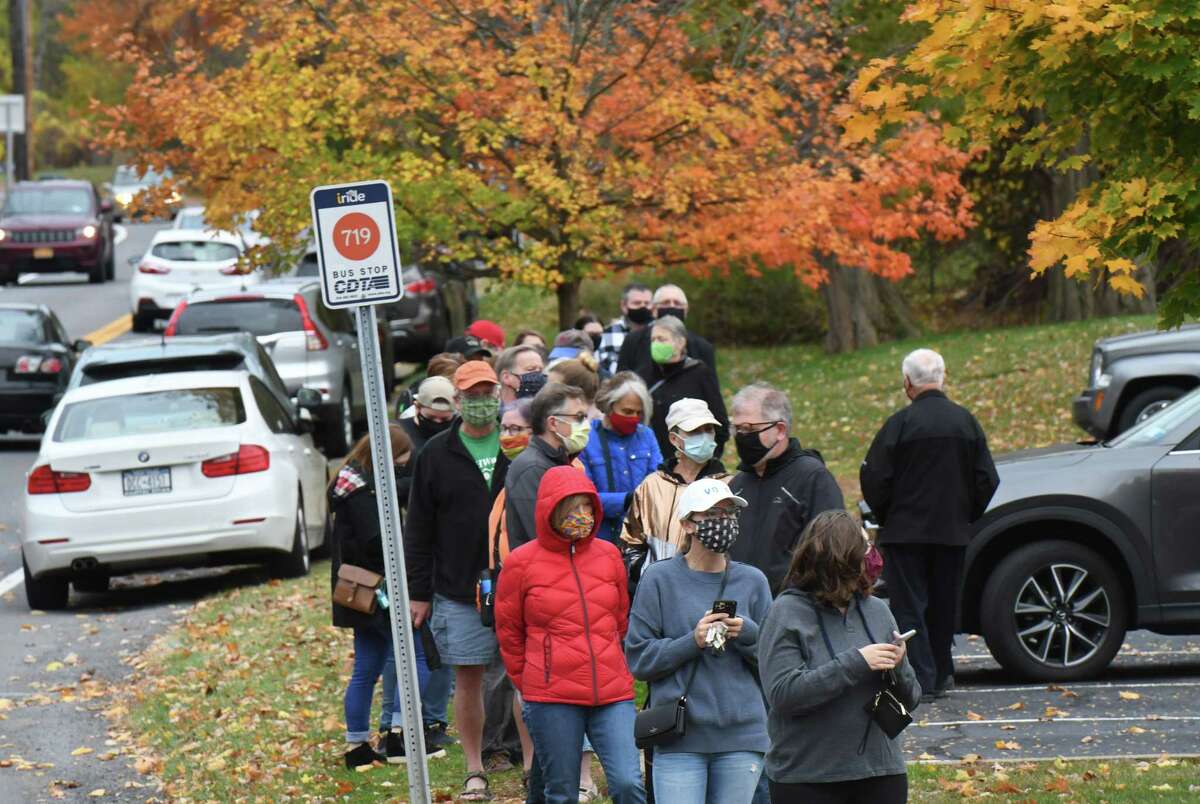 Voters stand in line at the Bethlehem Lutheran Church polling station on the first day of early voting in New York State on Saturday, Oct. 24, 2020, on Elm Avenue in Delmar, N.Y. Early voting polls are open at varying hours throughout the week until Sunday, November 1. (Will Waldron/Times Union)