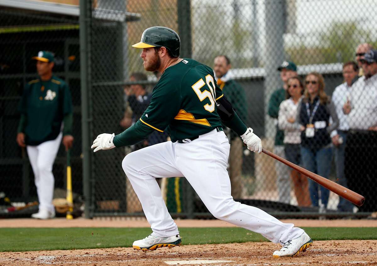 Oakland A' s Max Muncy hits an RBI single during intrasquad game at Spring Training at Fitch Park in Mesa, Arizona, on Saturday, February 28, 2015.