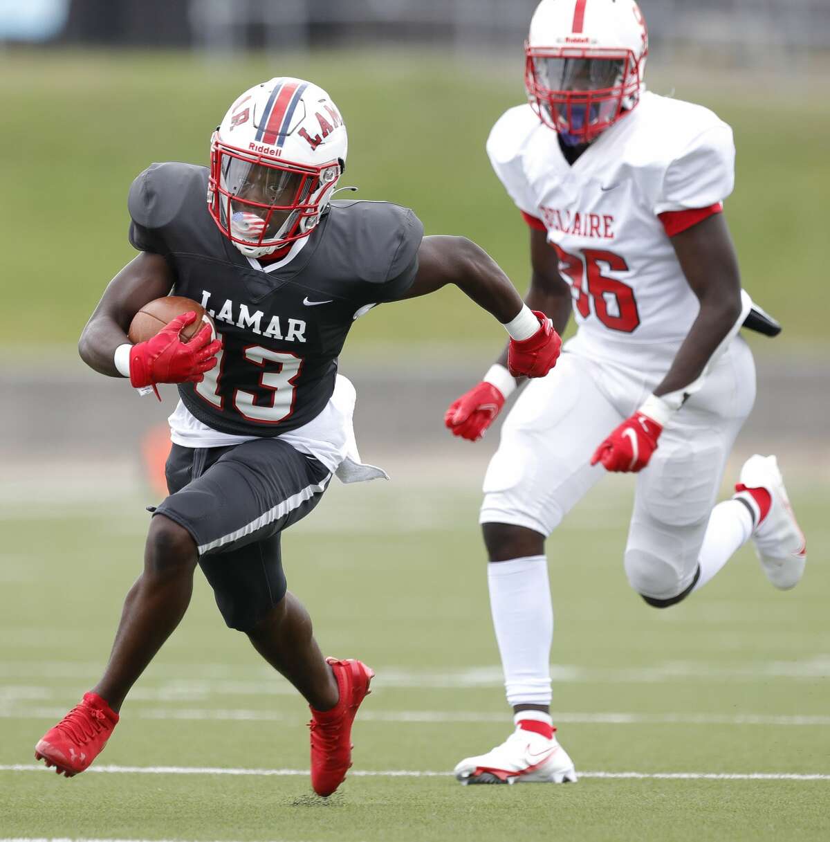 Lamar wide receiver TJ Rone (13) runs for a 29-yard touchdown during the second quarter of a District 18-6A high school football game at Delmar Stadium, Saturday, Oct. 24, 2020, in Houston.