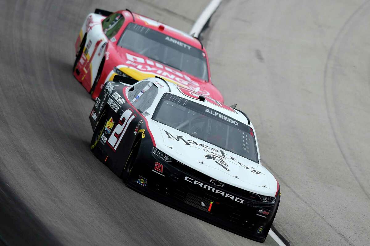 Anthony Alfredo, driver of the #21 Maestro's Classic Chevrolet, and Michael Annett, driver of the #1 Pilot/Flying J Chevrolet, race during the NASCAR Xfinity Series O'Reilly Auto Parts 300 at Texas Motor Speedway on October 24, 2020 in Fort Worth, Texas.