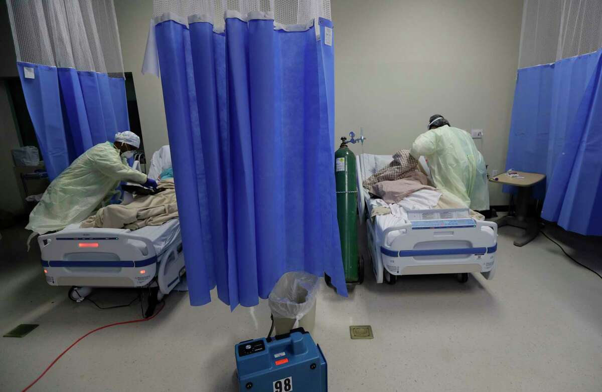 Medical personnel watch over COVID-19 patients at DHR Health, Wednesday, July 29, 2020, in McAllen, Texas. (AP Photo/Eric Gay)