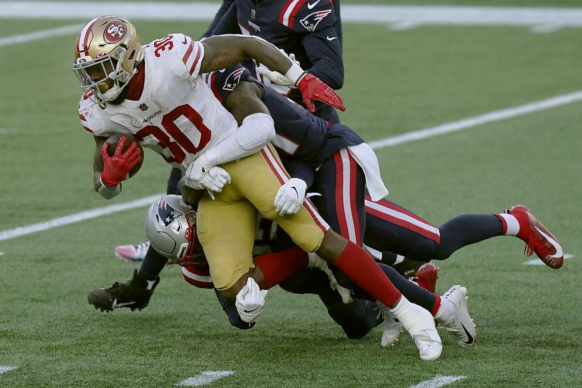 San Francisco 49ers running back Jeff Wilson Jr. gains yardage against the New England Patriots in the first half of an NFL football game, Sunday, Oct. 25, 2020, in Foxborough, Mass. (AP Photo/Steven Senne)