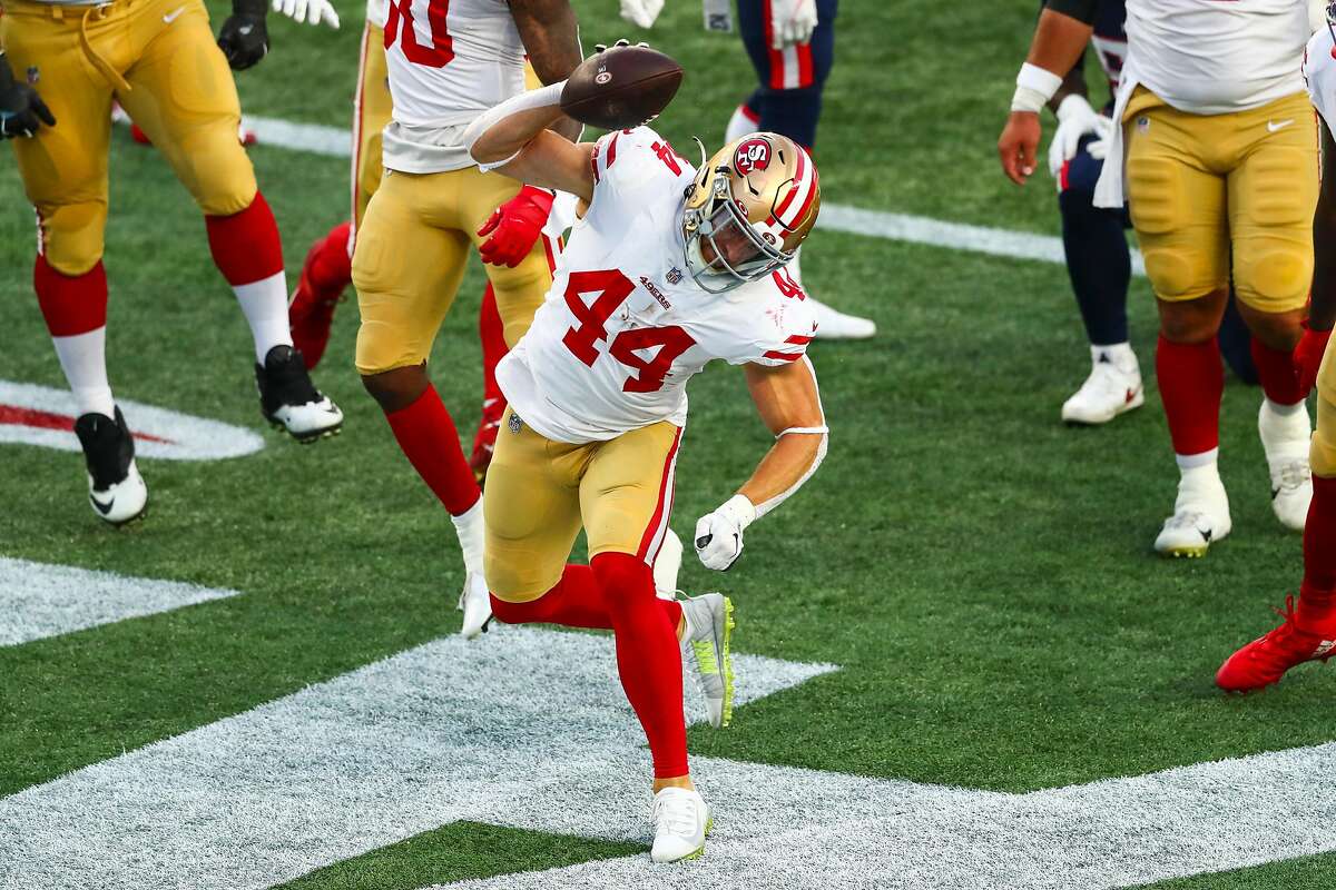 Kyle Juszczyk #44 of the San Francisco 49ers reacts after scoring a touchdown during the first half of a game against the New England Patriots on October 25, 2020 in Foxborough, Massachusetts.