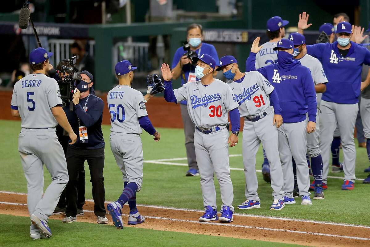 Los Angeles Dodgers' Mookie Betts steals second past Tampa Bay Rays  shortstop Willy Adames during the sixth inning in Game 3 of the baseball World  Series Friday, Oct. 23, 2020, in Arlington