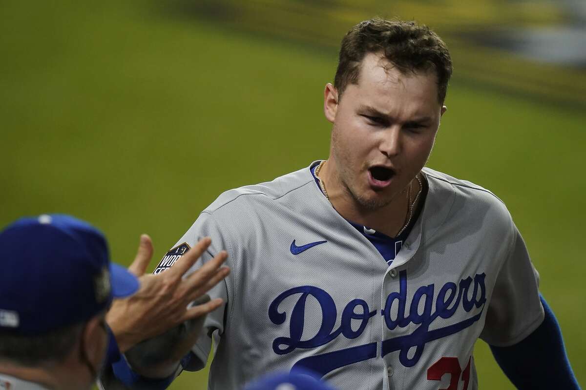 Los Angeles Dodgers' Joc Pederson celebrates a home run against the Tampa Bay Rays during the second inning in Game 5 of the baseball World Series Sunday, Oct. 25, 2020, in Arlington, Texas.