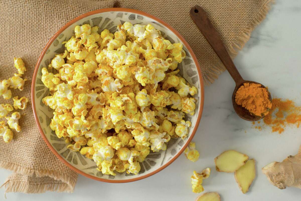 Ginger Turmeric popcorn is made with ground ginger and turmeric and lemon zest.