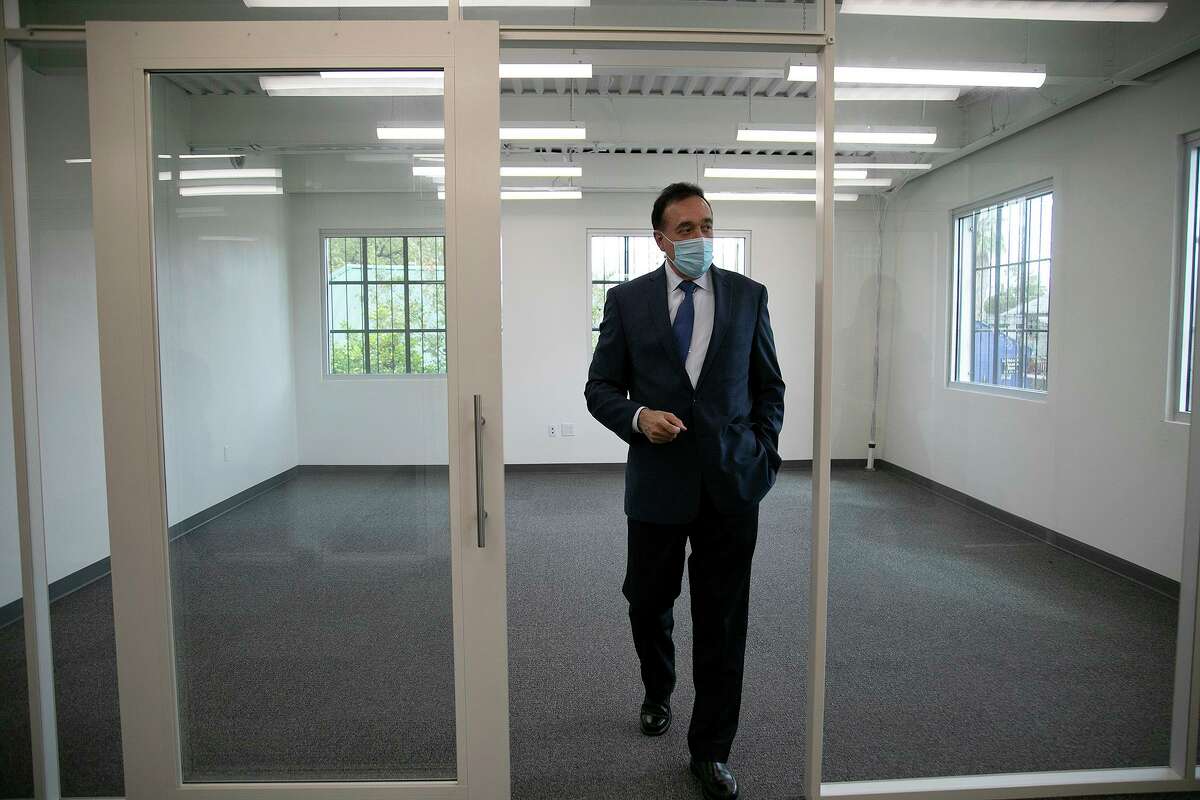 Henry Cisneros walks around a building that once housed his grandfather’s print shop. He has been renovating it.