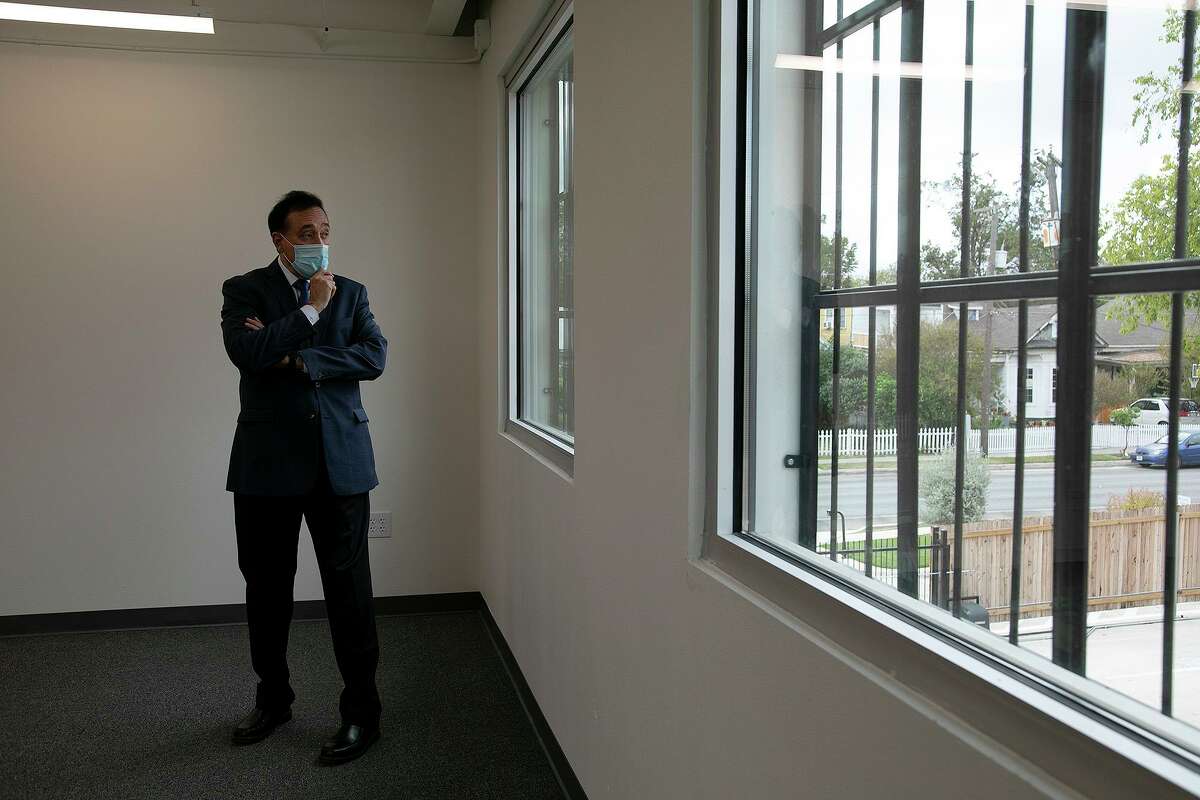 Henry Cisneros walks around a building that once housed his grandfather’s print shop. He had been renovating it for co-working spaces but now plans to move his investment firm into it.