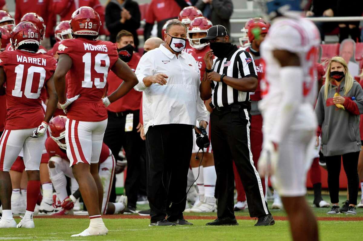 Before he took over Arkansas this season, Sam Pittman, center, spent his career as an offensive line coach. So far, the first-year coach is 2-2 with victories over Mississippi and Mississippi State.