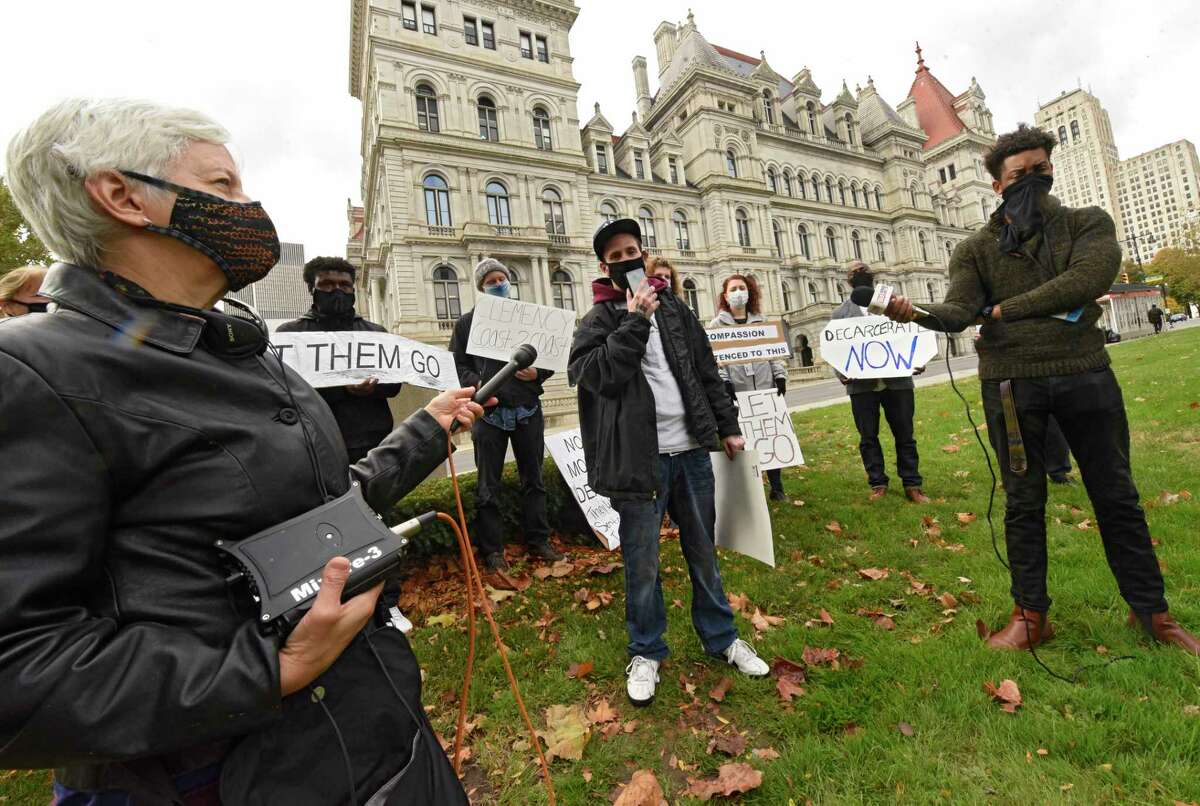 Antonio Dayter of Albany, who recently was released from Greene Correctional Facility, talks about the poor conditions of the prison in these COVID-19 times during a protest outside the New York State Capitol on Tuesday, Oct. 27, 2020 in Albany, N.Y. The event was part of a zoom meeting type protest with others around the state. There was a chair set up with a computer on it showing the zoom meeting. (Lori Van Buren/Times Union)