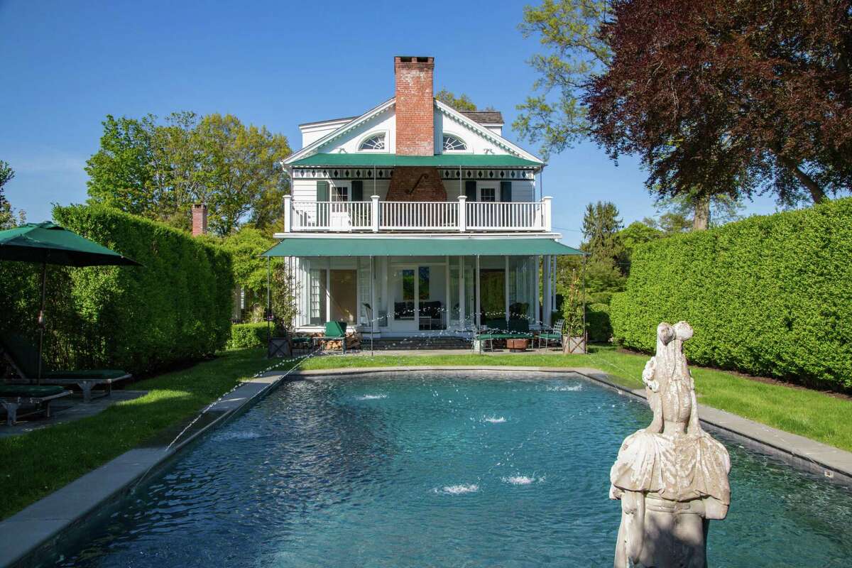 The large screened porch and the master suite deck above it both look over the in-ground swimming pool. Although this house was built in 1929, just before the October 1929 stock market crash and resulting Great Depression cast a pall over the country, the grandeur of this estate was not diminished. In fact, the design of this gracious home was intended for relaxed, beachside living as well as living and entertaining in grand style, which remains the case today. “Imagine the elegant cars slipping behind the privet hedge to enjoy a lavish dinner party, greeted in the spacious foyer with a glass of champagne and the sound of a jazz combo and laughter of the other lucky invitees mingling in the living room, or roaming out to the veranda and (in-ground swimming) pool with its sparkling fountain to take in the sea breezes … and ocean vista,” the co-listing agents said.