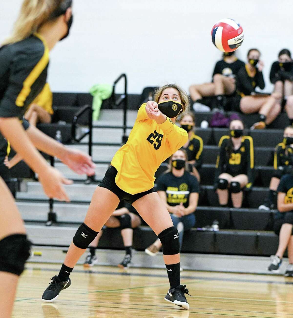 Laura Ellison returns a serve for Law in its win against Foran. Law added a victory over Shelton to improve to 7-2.