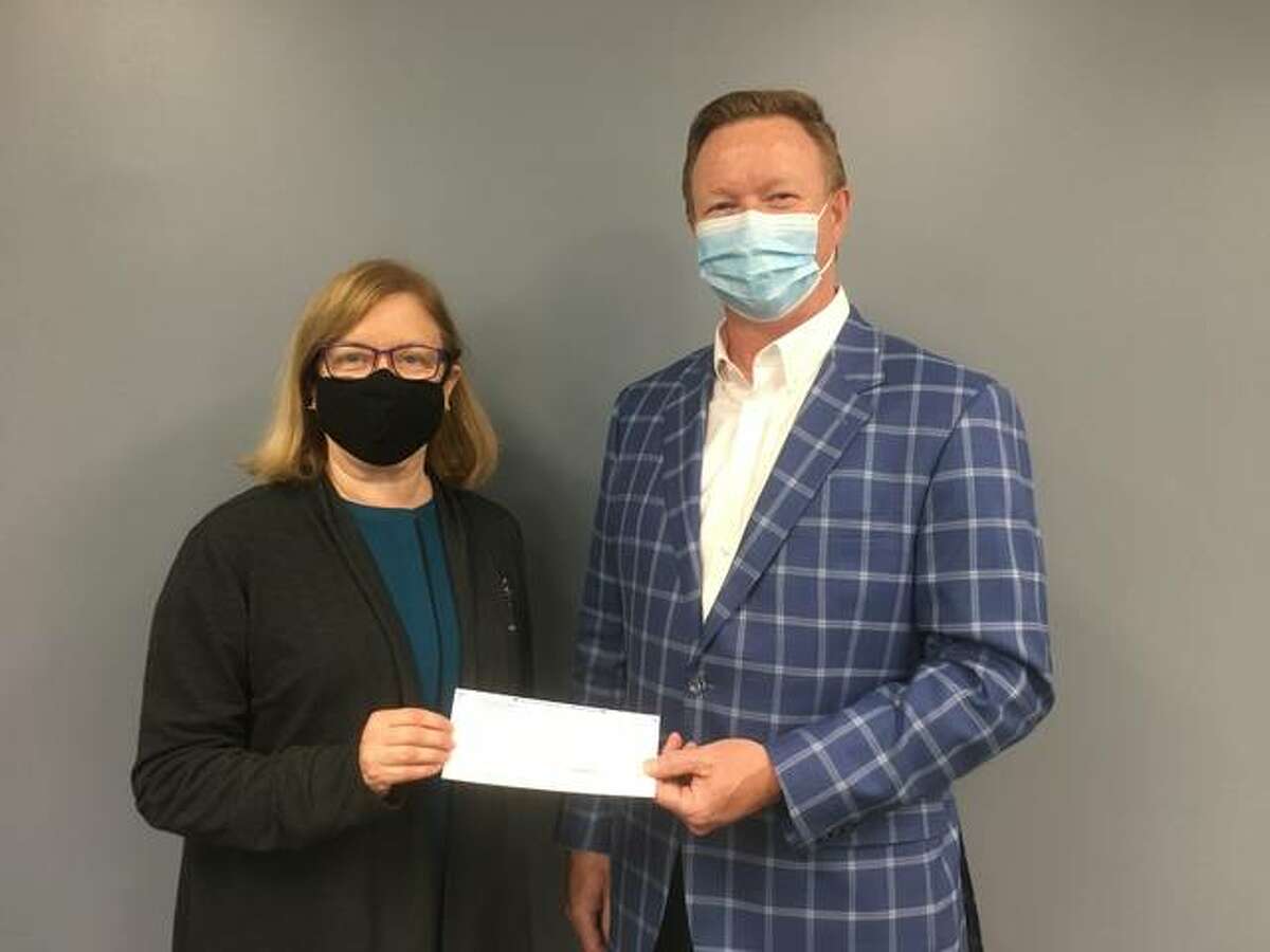 Scott Credit Union has donated $2,500 to help Nurses For Newborns prevent infant mortality, child abuse and neglect. Pictured from left are Nurses For Newborns CEO Melinda Monroe and Scott Credit Union President & CEO Frank Padak.