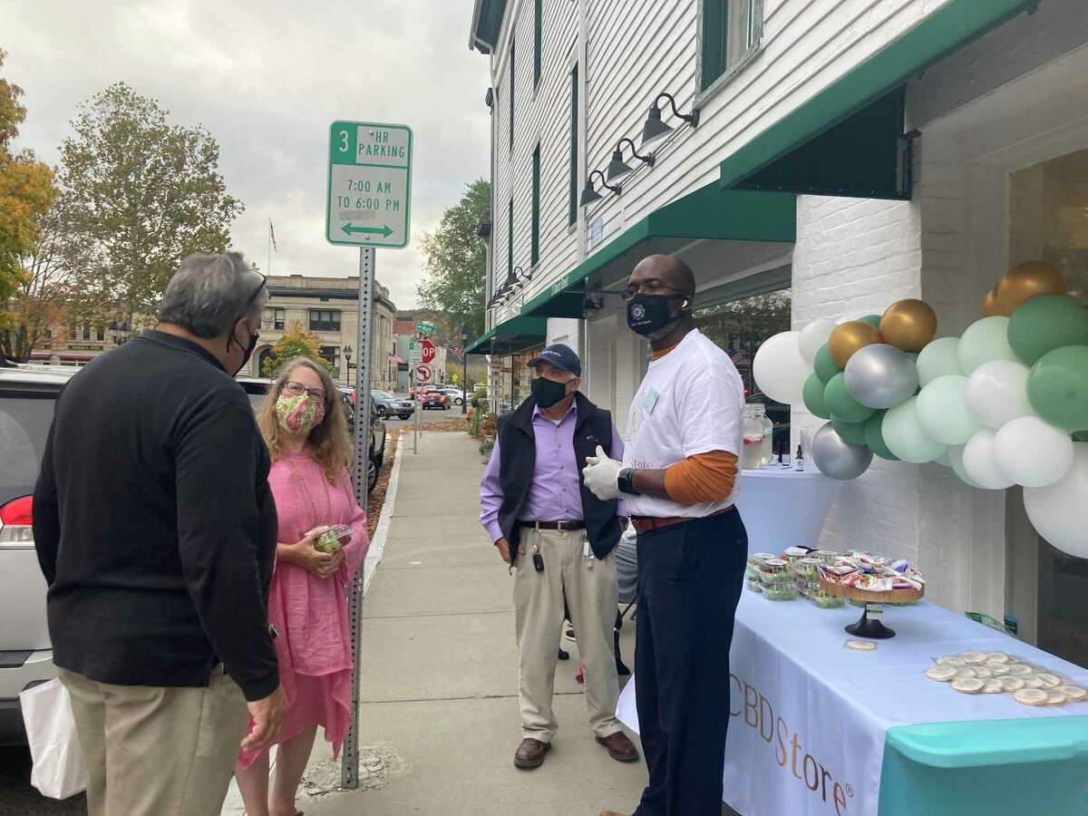 Connecticut residents John Chopourian, Donna Katsuranis, Stu Kaufman and Jonathan Mickens on the day of Your CBD Store's grand opening event in New Milford on Wednesday, Oct. 21, 2020.