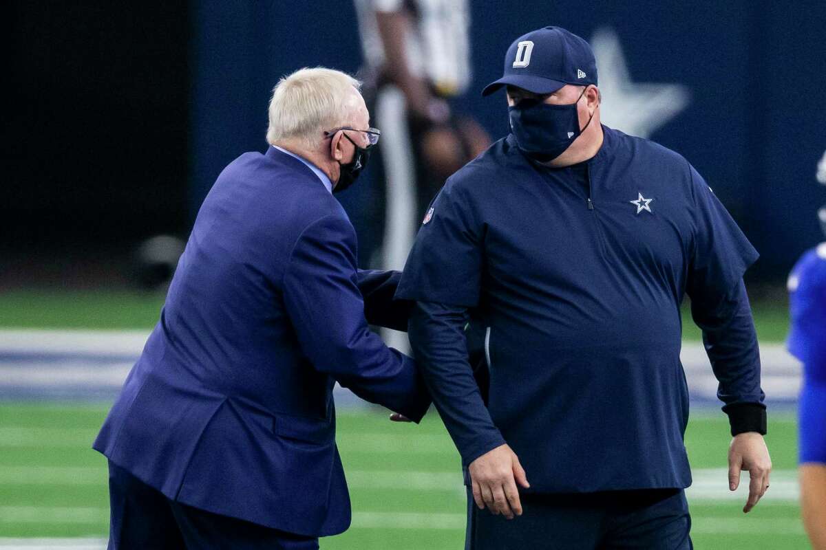 Dallas Cowboys owner Jerry Jones, left, greets head coach Mike McCarthy before an NFL football game against the New York Giants, Sunday, Oct. 11, 2020, in Arlington, Texas. Dallas won 37-34. (AP Photo/Brandon Wade)
