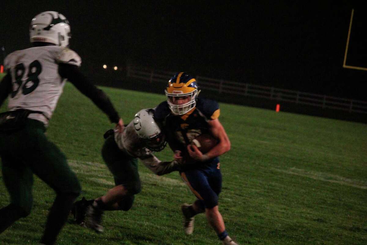 Evart's Bryant Calderon looks for yardage against Pine River on Thursday. (Herald Review photo/John Raffel)