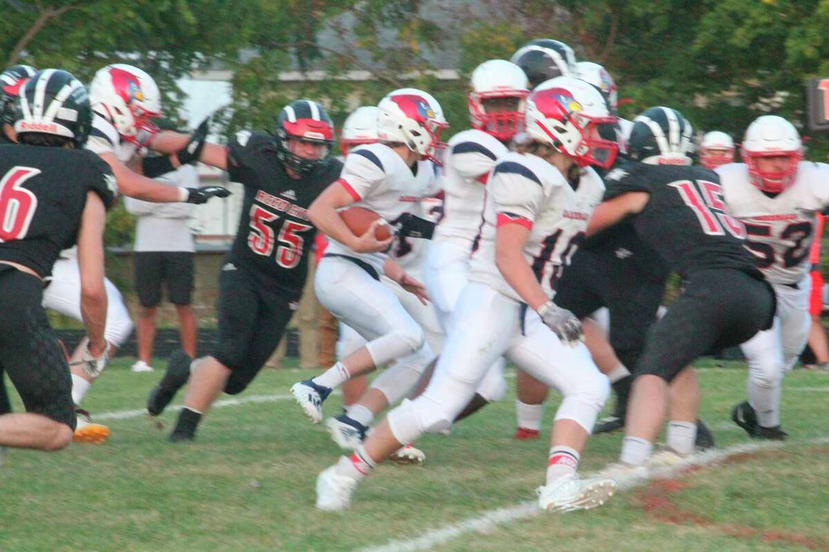 Reed City's Teddy Cross (55) goes after the ball carrier in action earlier this season. (Herald Review file photo)