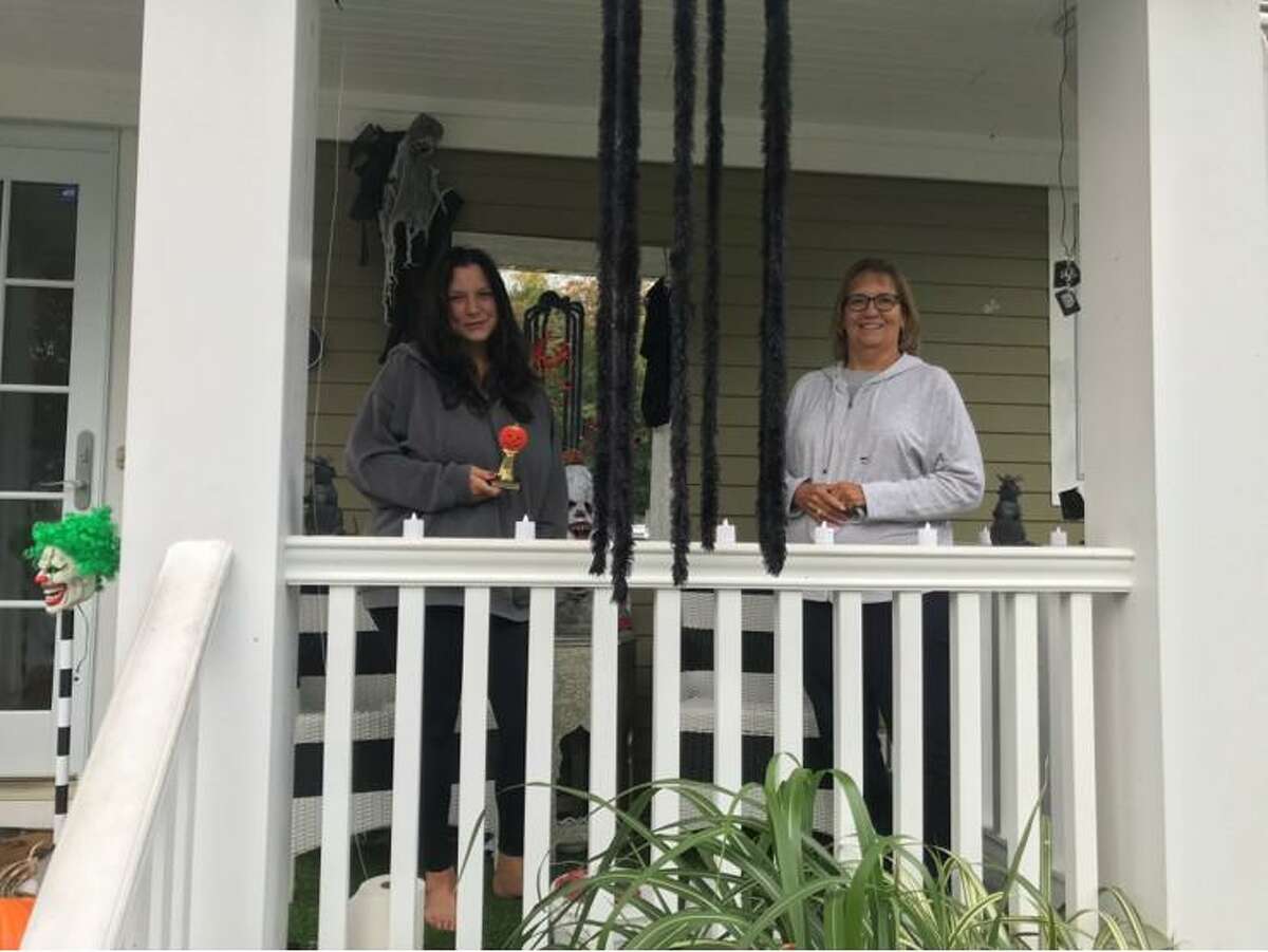 A Halloween House Decorating contest, sponsored by Trumbull Community Women (TCW) was held this month and 26 houses were entered in the contest. Each winner received a gift certificate and a trophy. The winners are shown receiving their awards from Halloween House Decorating Chairwoman Loretta Chory. For Scariest: 196 Sterling Road, Rich and Kim Roldan; Most Whimsical: 21 Lantern Hill, Tiffany Eastman and Todd Gagner; and Best Homemade Decorations, 10 Fox Court, Sandy Shilling.