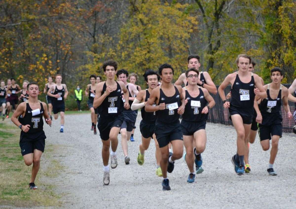 Trumbull led by Elliott Bello (middle) runs in a pack on its way to its fifth consecutive win of the season.