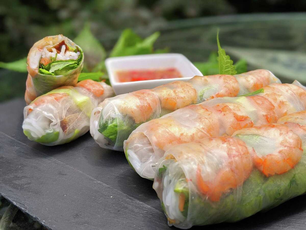 Vietnamese spring rolls are made with lettuce, herbs, cucumber and shrimp; served with a peanut hoisin sauce.