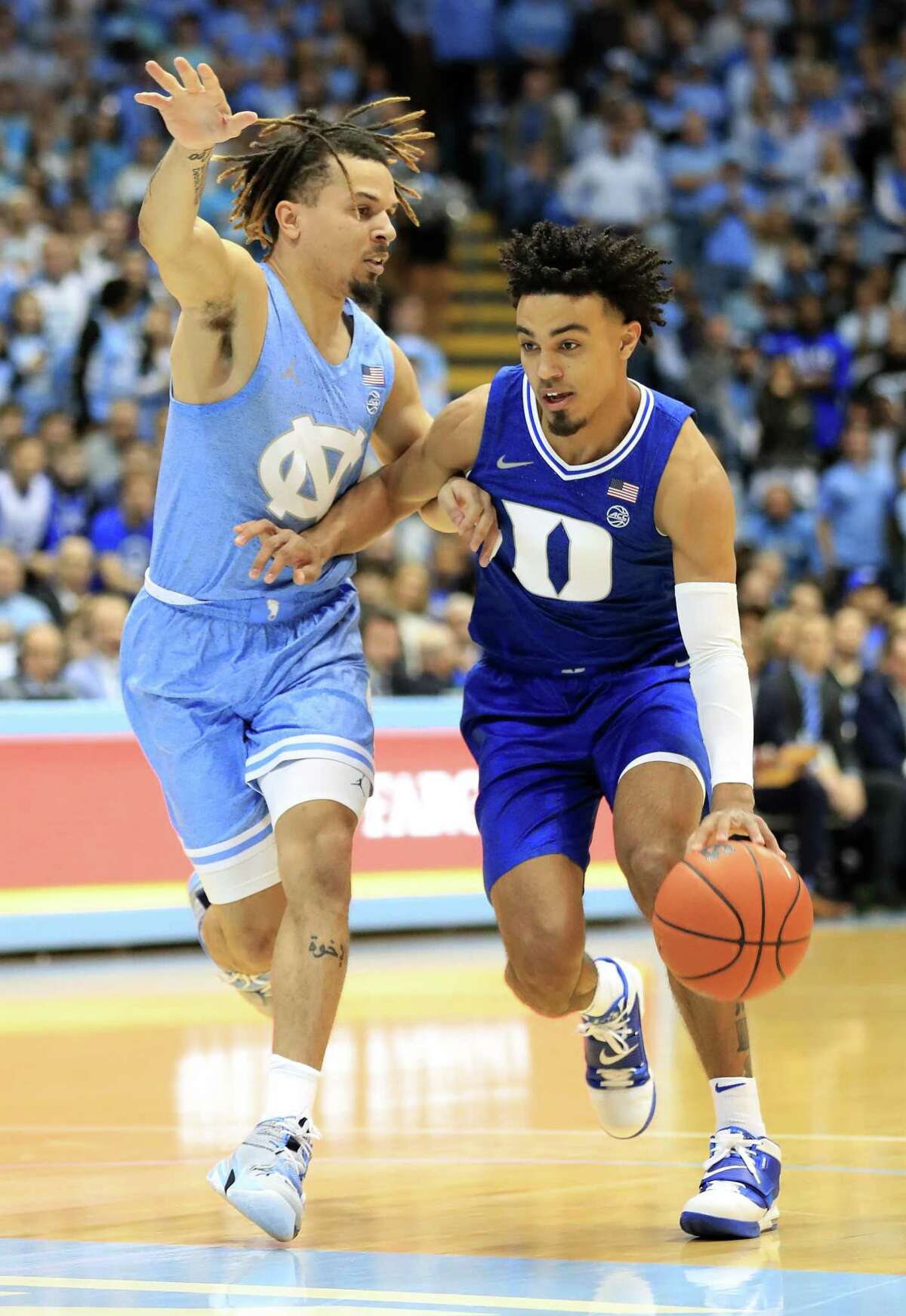 CHAPEL HILL, NORTH CAROLINA - FEBRUARY 08: Tre Jones #3 of the Duke Blue Devils drives to the basket against Cole Anthony #2 of the North Carolina Tar Heels during their game at Dean Smith Center on February 08, 2020 in Chapel Hill, North Carolina. (Photo by Streeter Lecka/Getty Images)